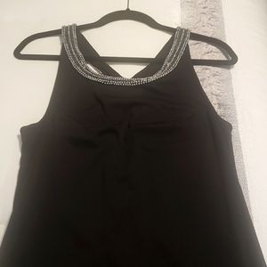 Black minidress with silver beaded neckline and figure8 beaded back cutout